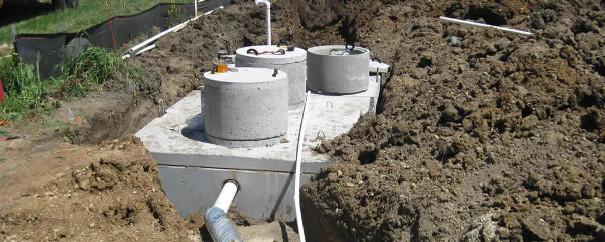 Septic system repair and installation site with tank access ports in Providence, RI